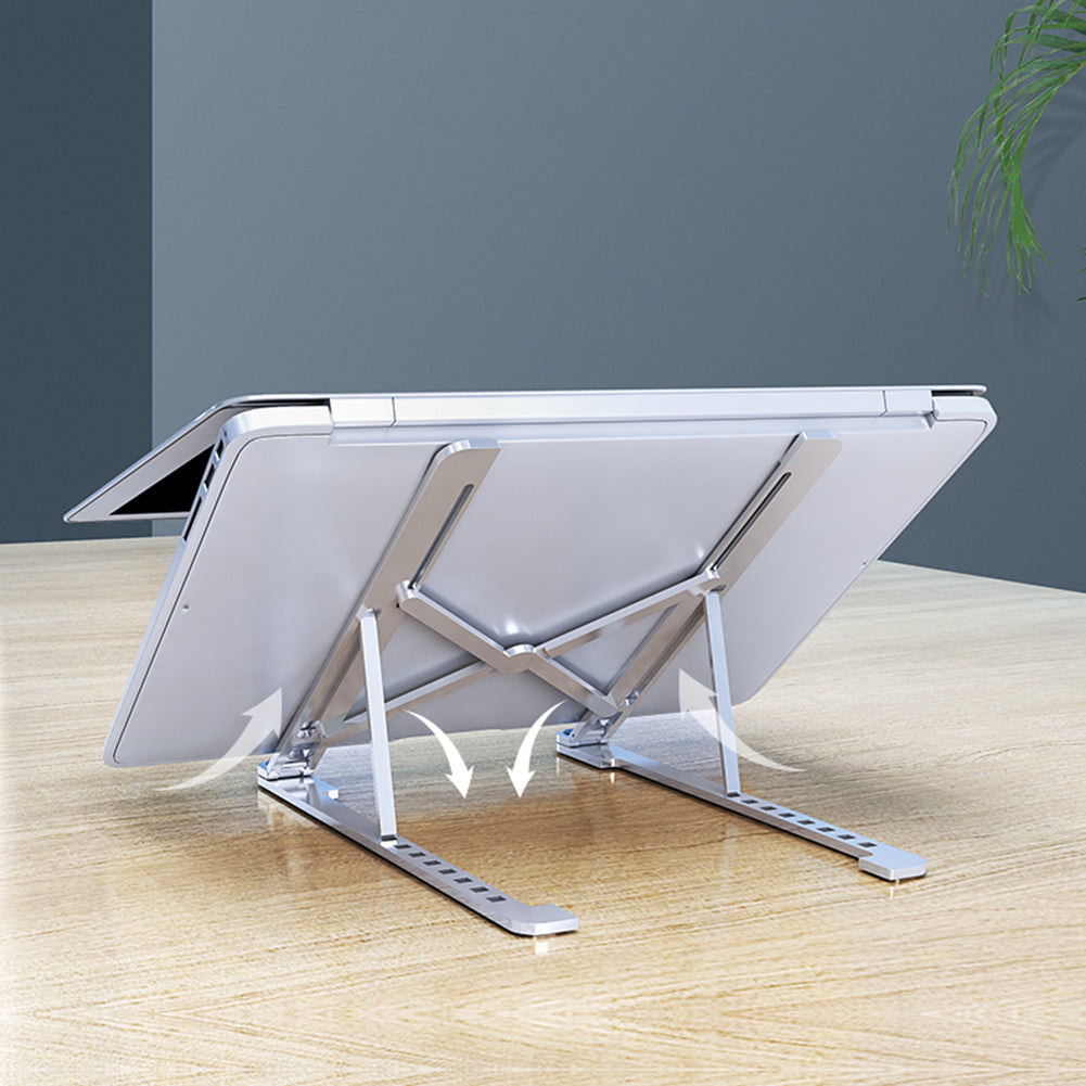 Apex portable aluminum alloy ergonomic laptop stand folded flat next to a notebook