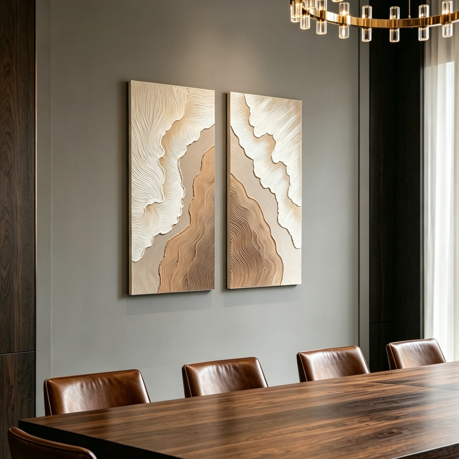 Light catching the reflective gold accents on the neutral abstract modern wall art panels.