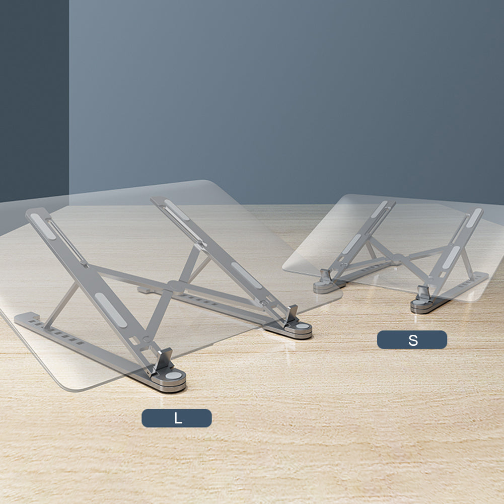 Minimalist grey and white desktop layout displaying laptop stand next to wireless dock