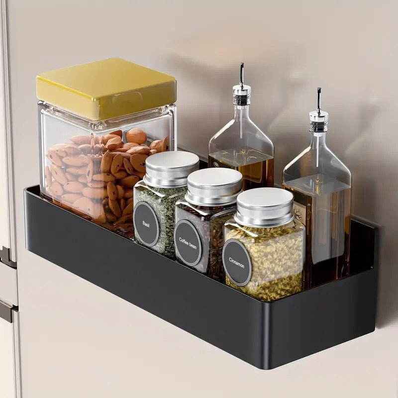 In-Use Image: Two white MagnaSpace magnetic kitchen organizer shelves stacked vertically holding spice containers.