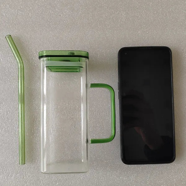A close-up of the high borosilicate glass cup showing its thick, durable square base.