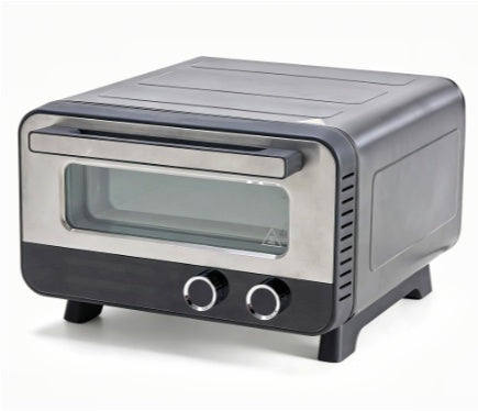 Close-up of Accessories: The included professional pizza stone and scraper peel next to the 1600w countertop pizza maker.