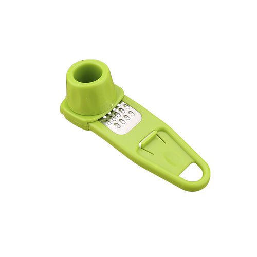 Main Product Image: AeroTwist manual garlic masher and grinder holding fresh minced cloves inside the chamber.