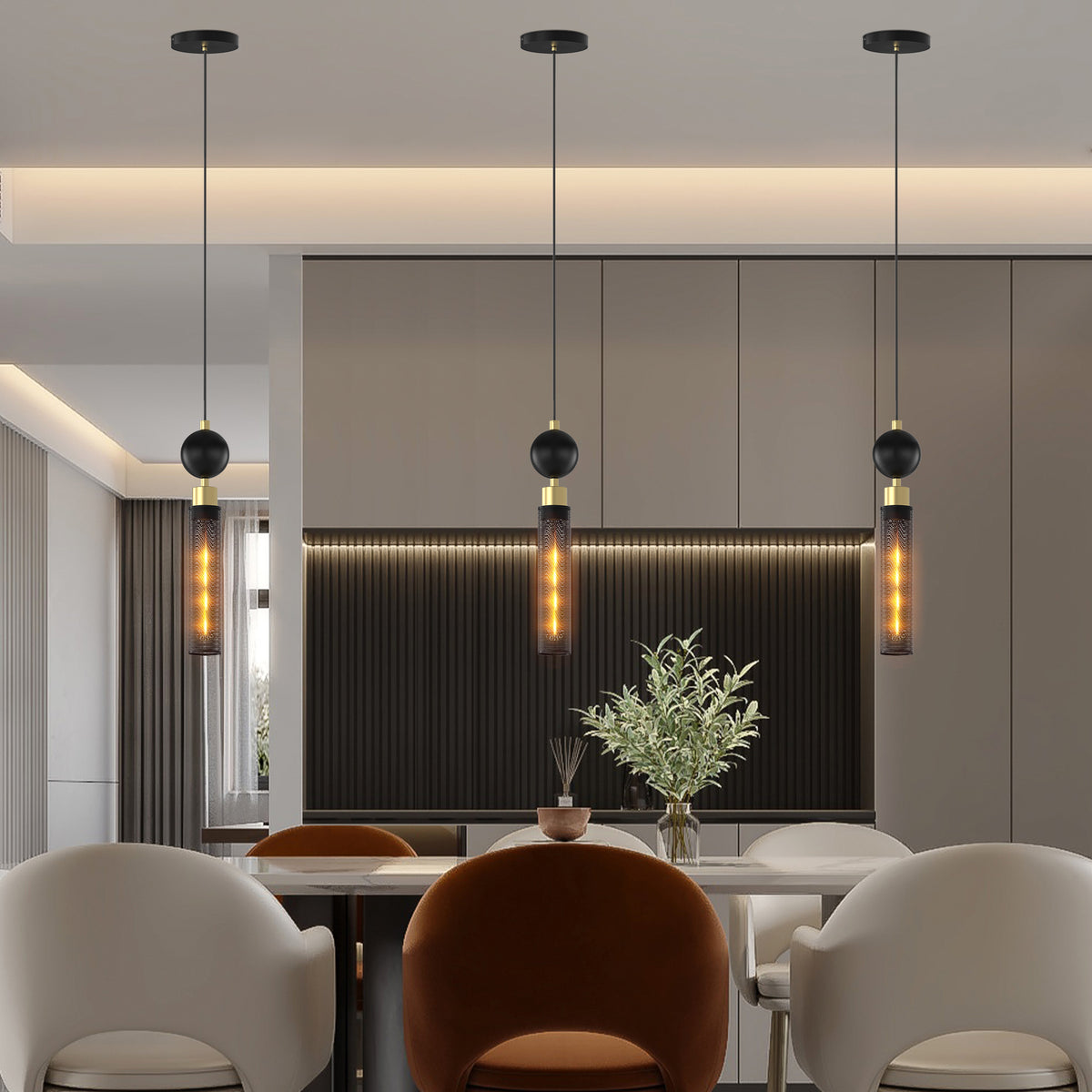 Minimalist modern hanging lighting casting an intimate, warm architectural glow over a contemporary dining area setup.