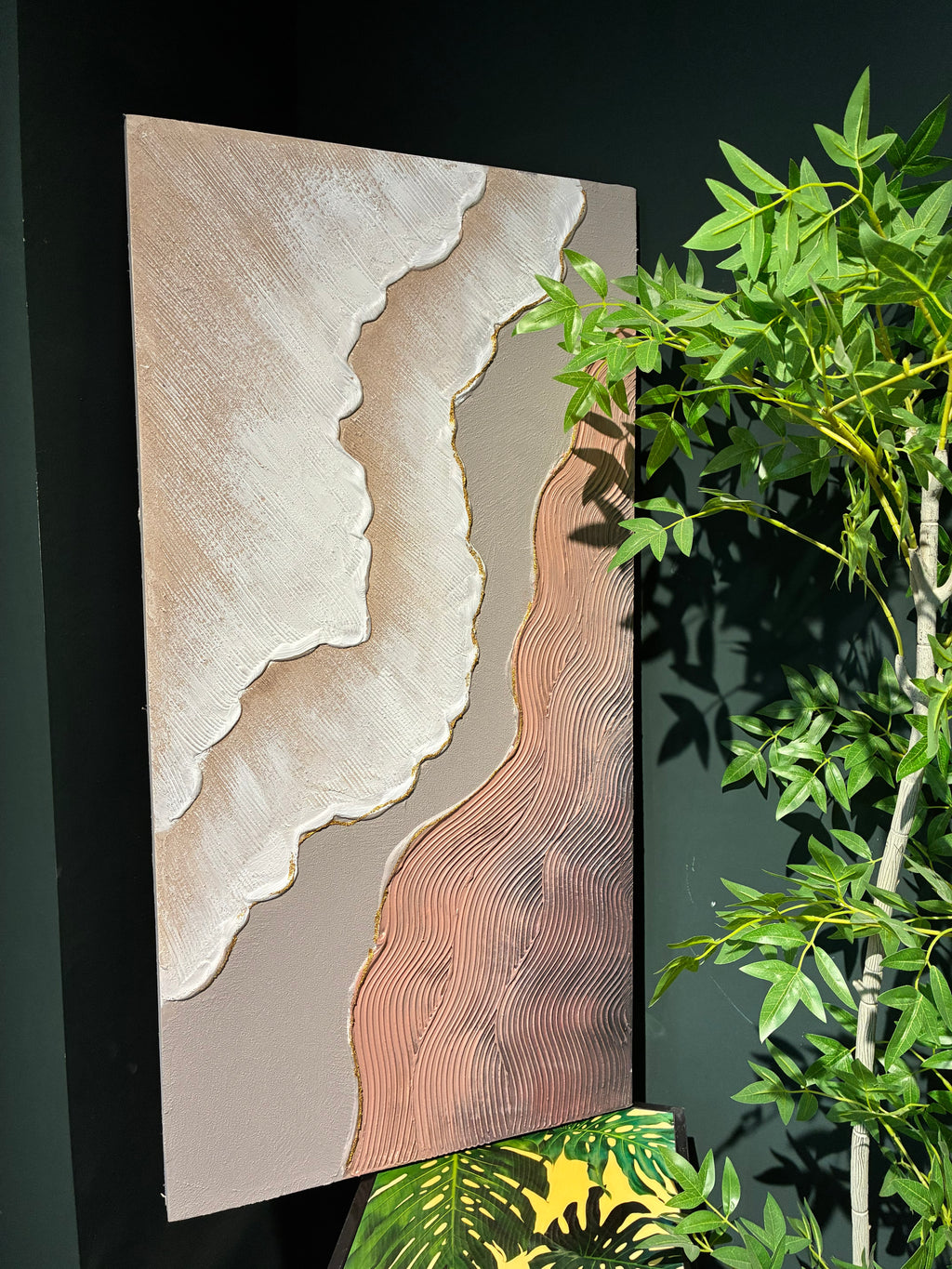 Coordinated pair of 20x40 neutral canvas paintings framing a minimalist entryway console table.