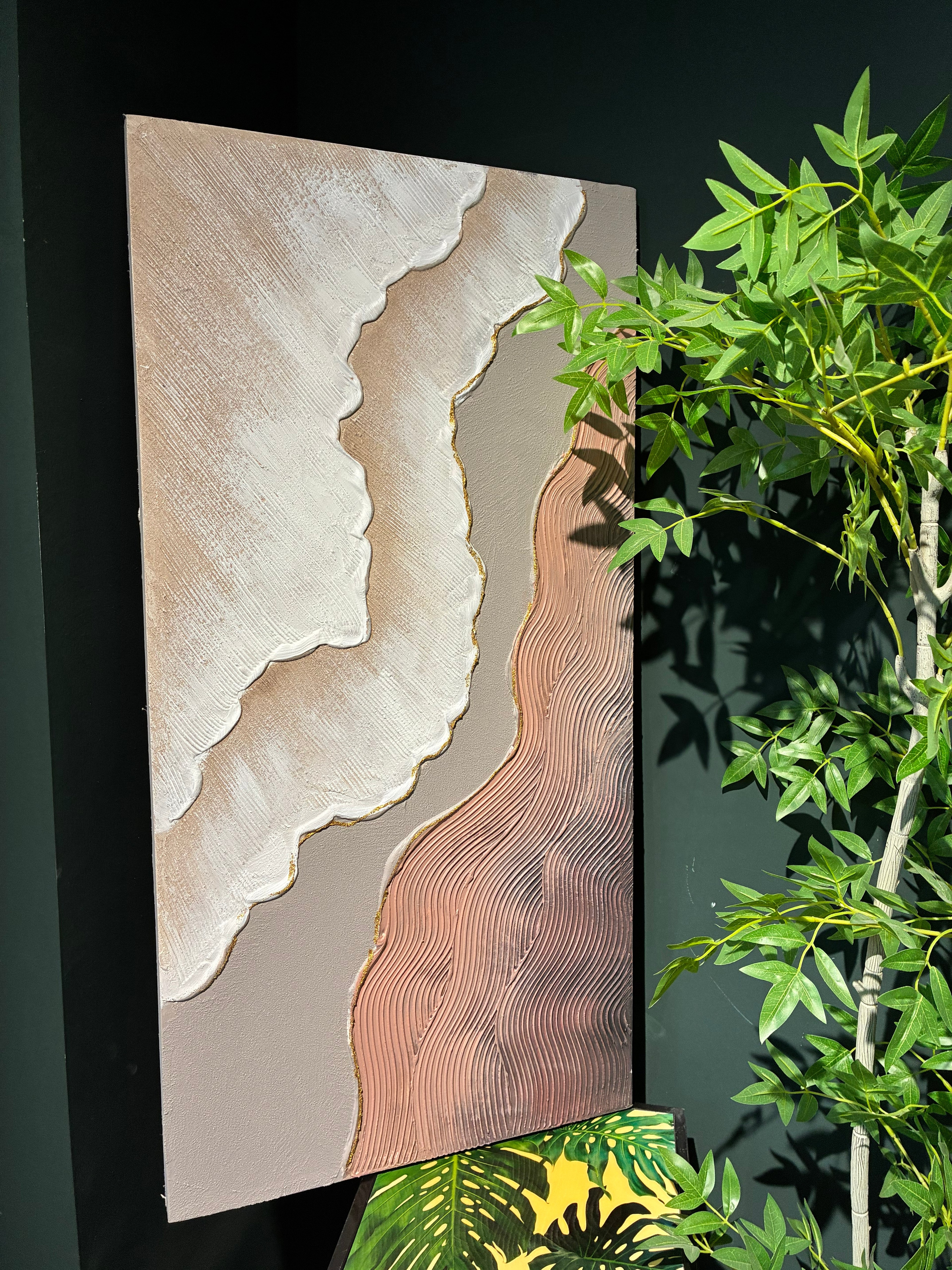 Coordinated pair of 20x40 neutral canvas paintings framing a minimalist entryway console table.