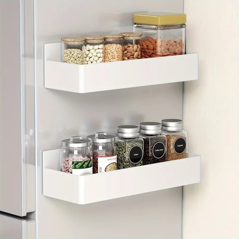 In-Use Image: Two white MagnaSpace magnetic kitchen organizer shelves stacked vertically holding spice containers.